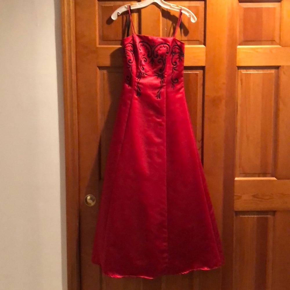 Red prom dress with black beading